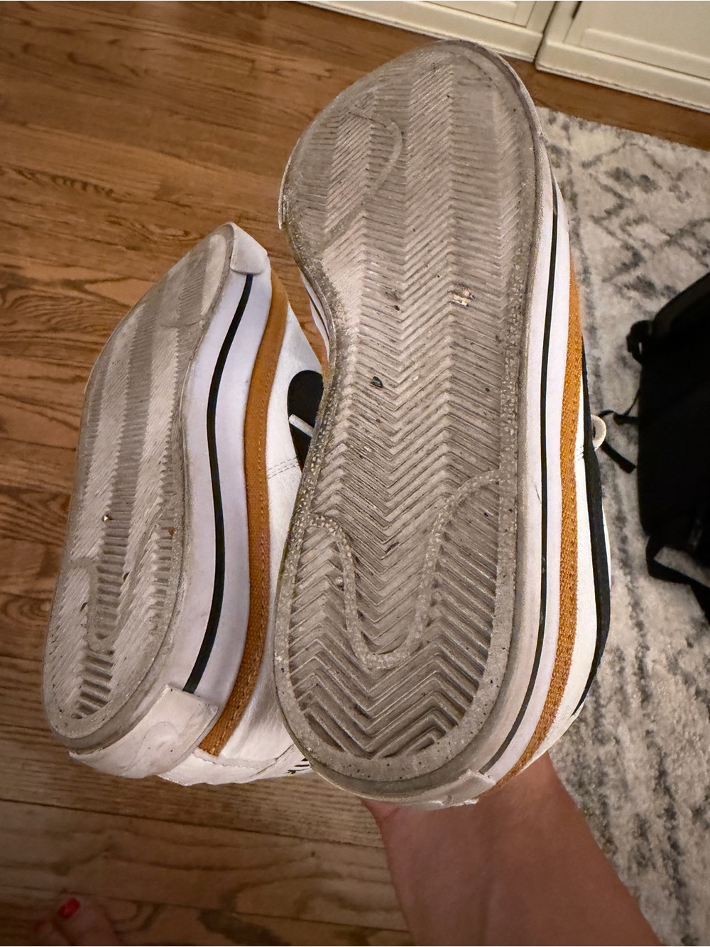 Nike White Sneakers with Black Swoosh and Gold Accent - Picture 4 of 5